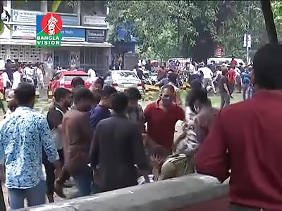 POLICEMAN BEING BEATEN BY MOB