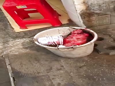 Head in a Bucket:  China Wuhan beheaded event