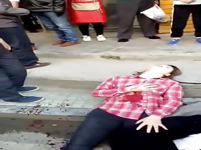 Two Chinese Girl Brutally Stabbed Still Agonizing on the Sidewalk