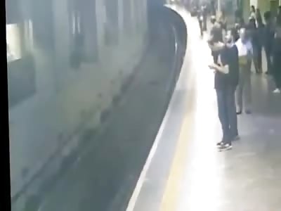 woman pushed to the train tracks