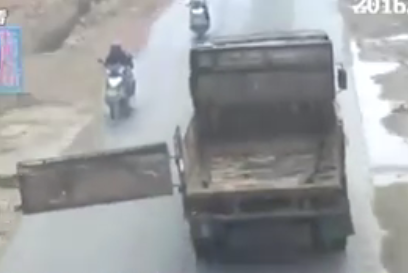 Truck's Dangling Tailgate Kills Motorcyclist Oncoming