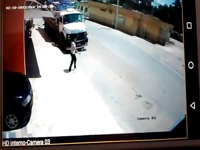Camera crashes between motorcycle and truck