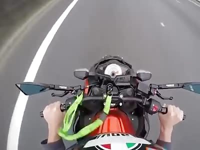 Motorcycle rider loses control and falls