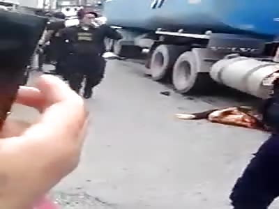Woman squashed by truck