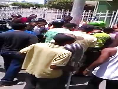 black thief beaten by furious population