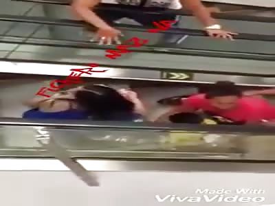 Minor is left with the hand trapped in escalator