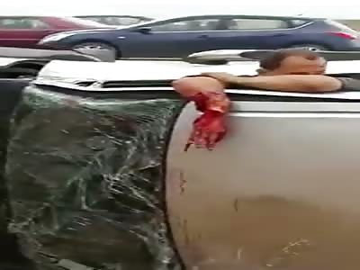 Guy Inside Car With Hand Dangling after Rollover