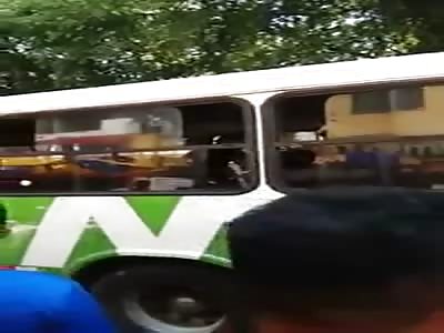 thief tries to steal bus but is hit by passengers