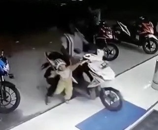 Amazing Footage of accident of a Motorcyclist and his son caught on CCTV