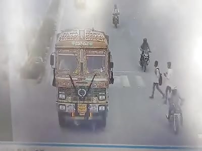 Two WOMEN When Crossing the Road has Meet with an TRUCK