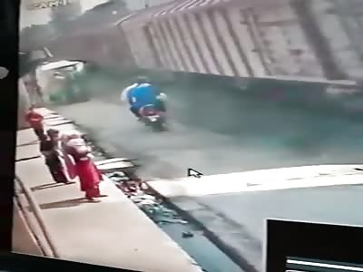 Couple Riding a Scooter Falls Under a Slow Moving Train