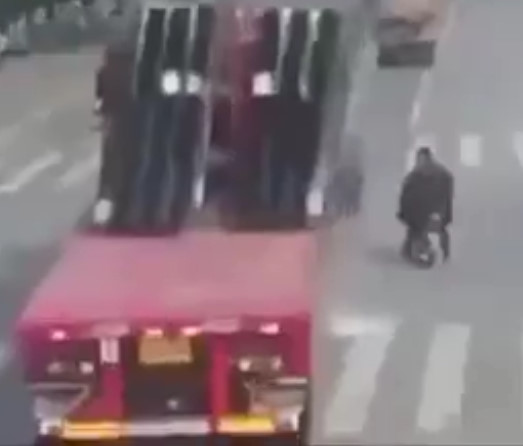 Panes of Glass Fall from Truck and Shatter on Top of Biker in China