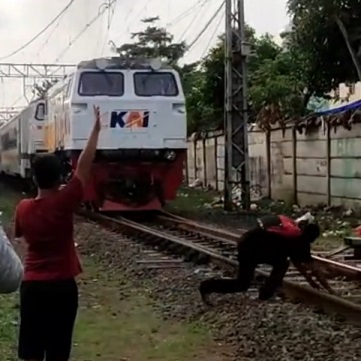 Indonesian Men Just Can't Stop Being Hit by Trains