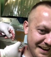 UA soldier gets treated for a shrapnel lodged near his neck and should