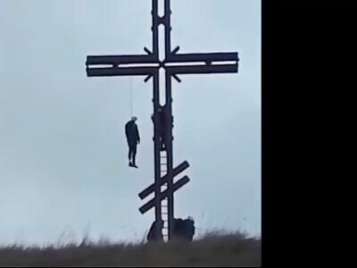 Guy hangs himself on a cross , sends God a message