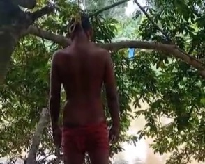 Depressed young man commit suicide by hanging himself on tree