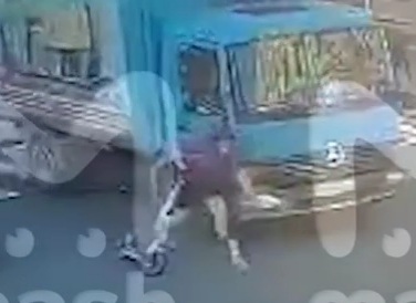 Young girl on electric scooter was run over by a truck