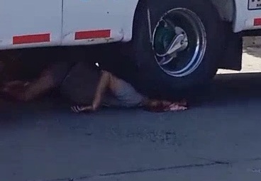 Head crushed under bus tire