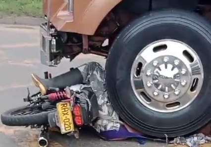 Motorcyclist crushed dead under big truck wheel 