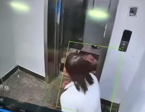 Woman Surprised by Stabbing Victim Lying in the Elevator.