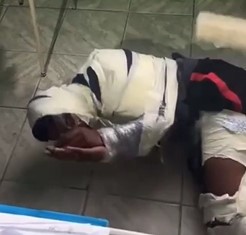 Thief Tied up like a Mummy Badly Beaten