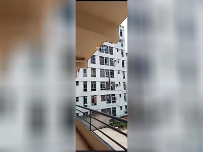 Husband helps his wife's lover escape through a building window.
