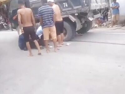 A boy was run over by a truck while crossing the road in Vietnam