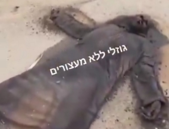 Israeli soldiers showing rotten dead body of Palestinian civilian 