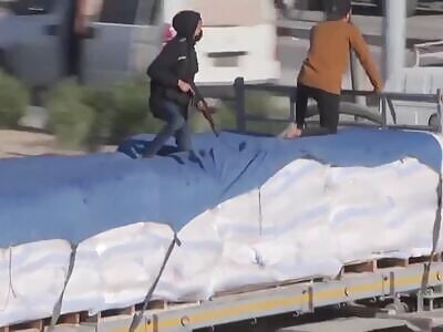 Hamas taking over a humanitarian aid truck from gazan civilians 