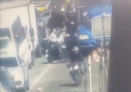 Two bikers lost control crashed under big truck 