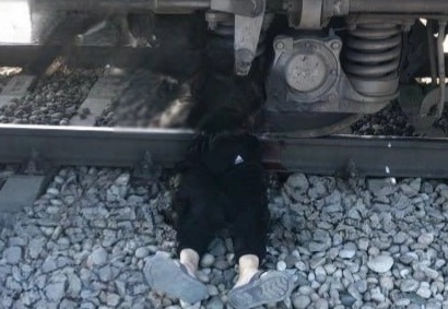 young man wearing headphones was hit by train
