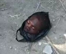 Decapitated head in plastic bag 