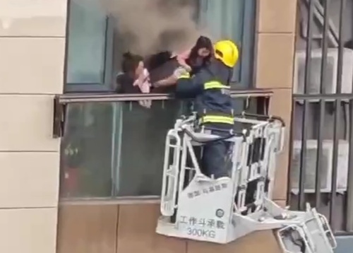 Mother and Daughter Burning in Building, Saved from Certain Death.