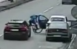 Cyclist was hit by a door and then run over by a car