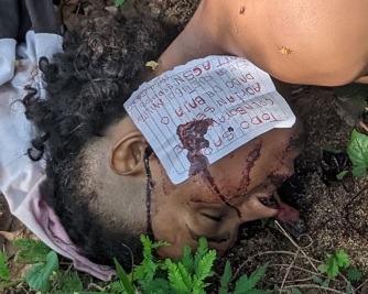 Dead body found in forest showing sign of torture and note on the face