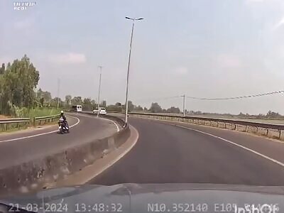 Biker goes wrong way down the highway and meets a truck head on.