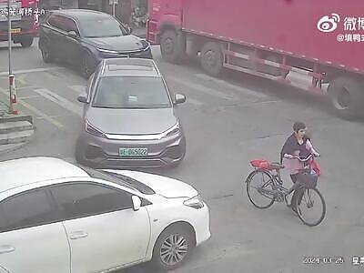 Cyclist walks in front of truck and gets run over twice.