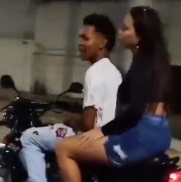 Man Riding with His Girl Better Pay Attention.