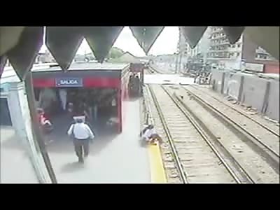 WTF. Mother Allowing Child on to Rail Line as Train Comes in to Station