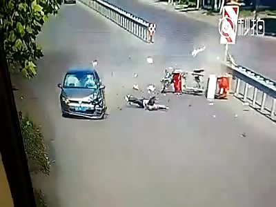 Rider Goes Flying in the Air after Getting Hit by a Car