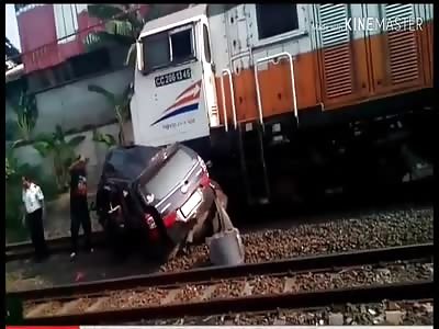 Second Train Crashes the Car with Passenger still Stuck Inside 