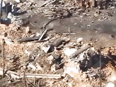 A Ukrainian machine gunner shoots at a group of Russians