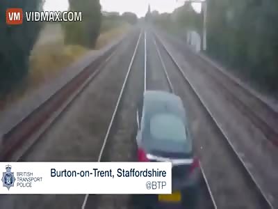 Train crashes into Car after man drives it on tracks