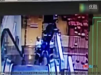 CCTV captures man and child's fatal fall from escalator  