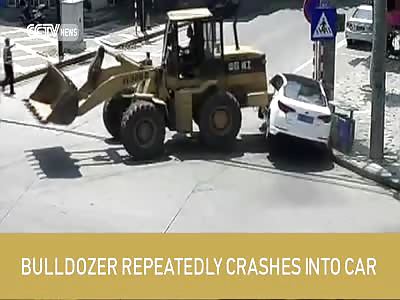 Footage: Bulldozer repeatedly crashes into car