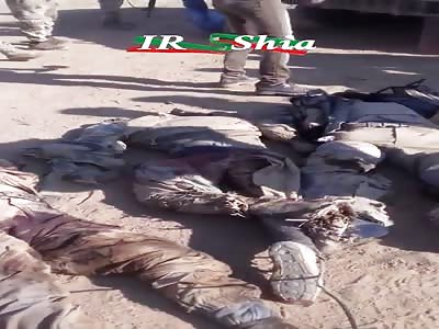 Video of ISIS terrorist's rotten body dragged through streets by jubilant rebels