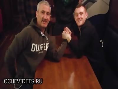 The moment a barmen arm wrestling a punter BREAKS a bone over a bet worth just Â£17   