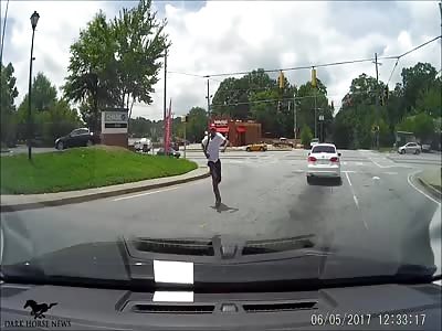 Man Jumps On Random Woman's Car And Kicks In Windshield