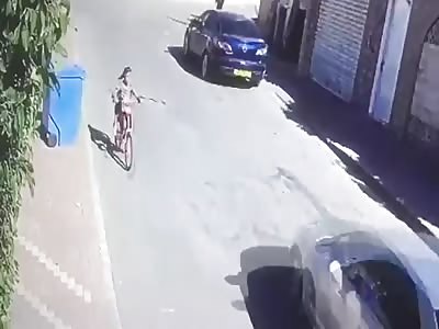 snake attempt to bite girl crossing the street in bike