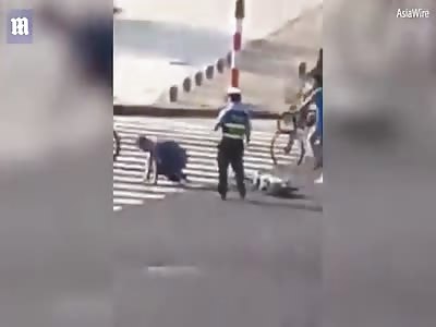  Traffic Officer Kicking A Man Off His Bike